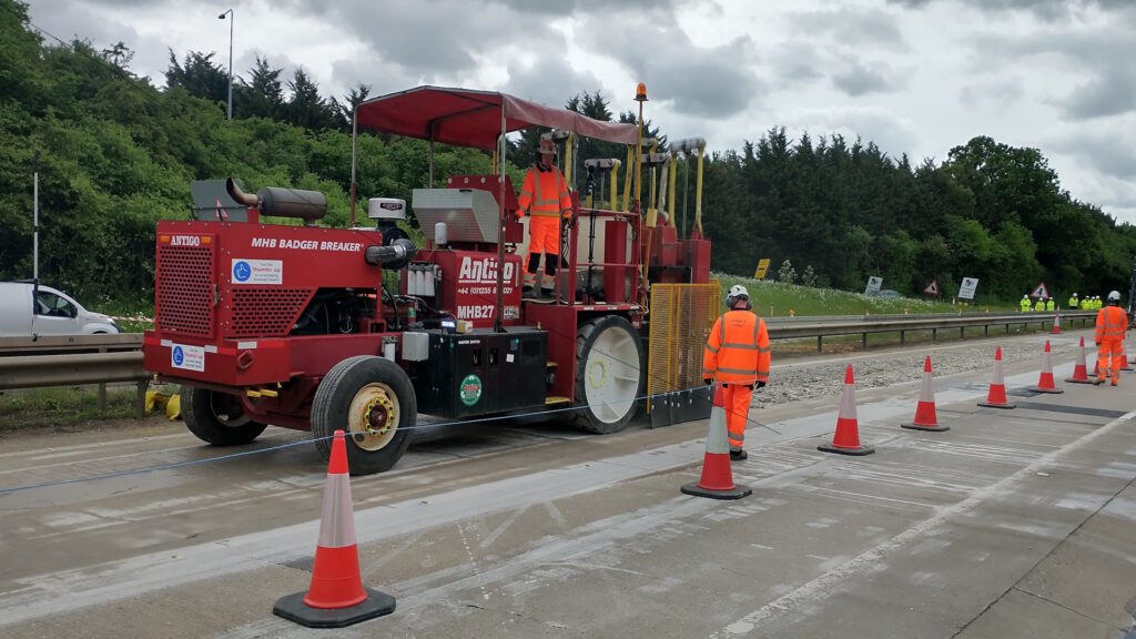 Breaker with construction worker on road
