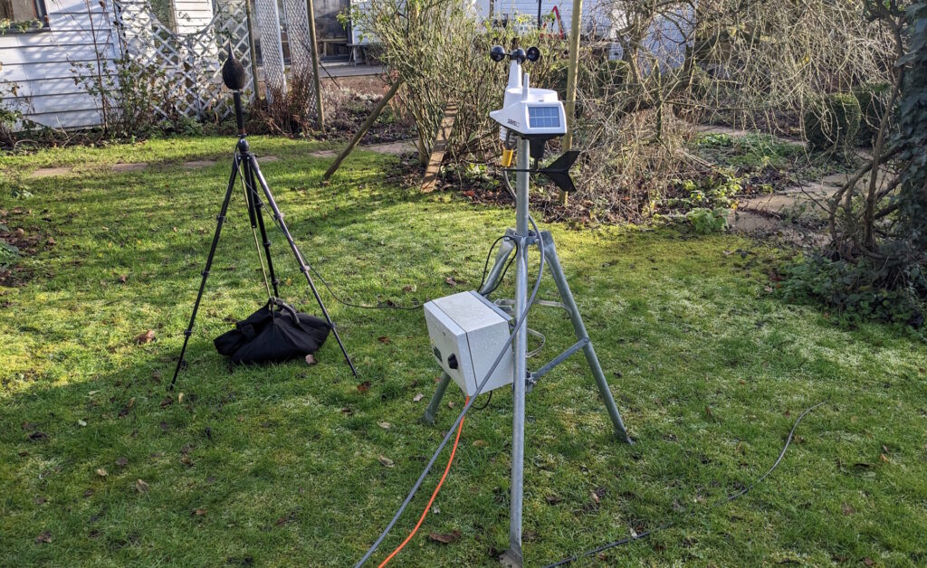 2 noise and vibration monitors in a garden